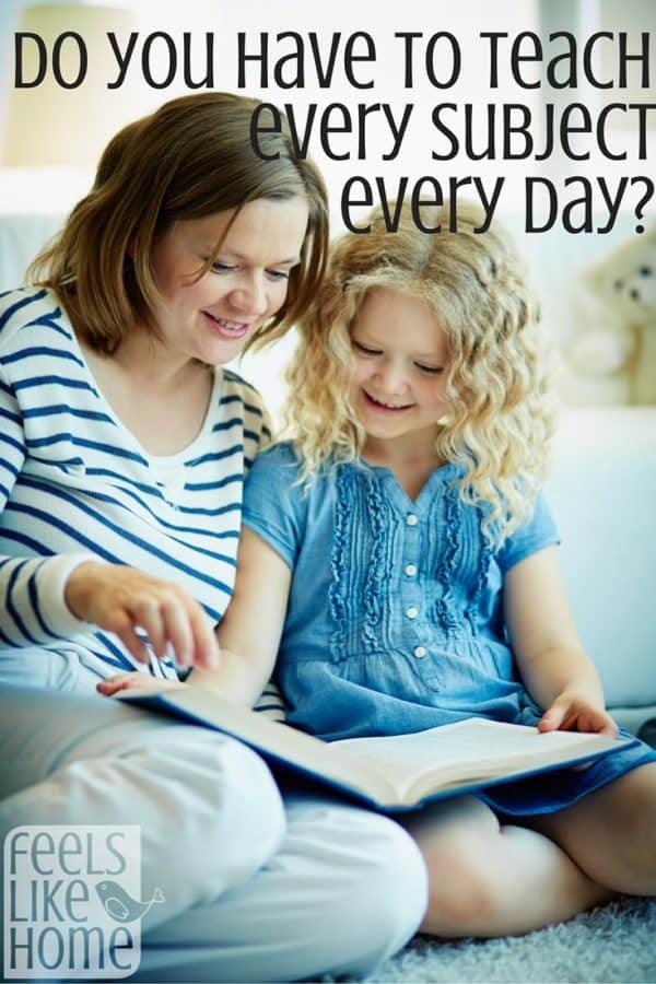 A homeschool mom reading to her daughter