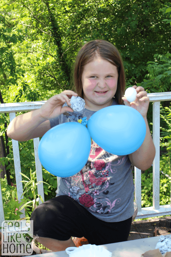 a little girl with a package and an egg