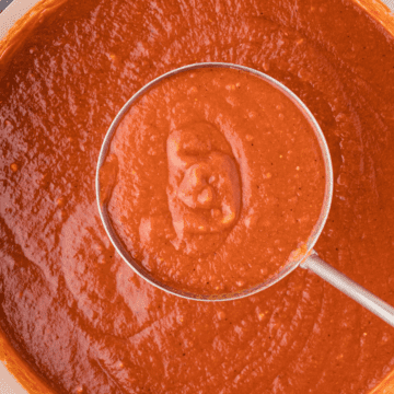 homemade Mexican enchilada sauce in a ladle
