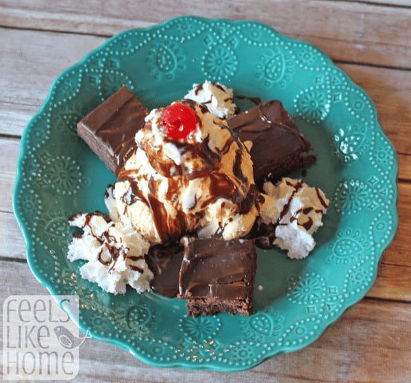 A hot fudge brownie sundae on a green plate