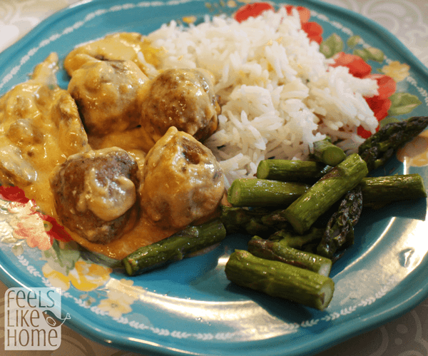 A plate of food, with Meatballs and Sauce