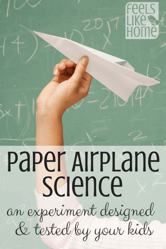 A person holding a paper airplane