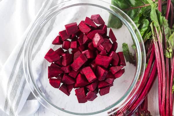 cut red beets in a glass bowl