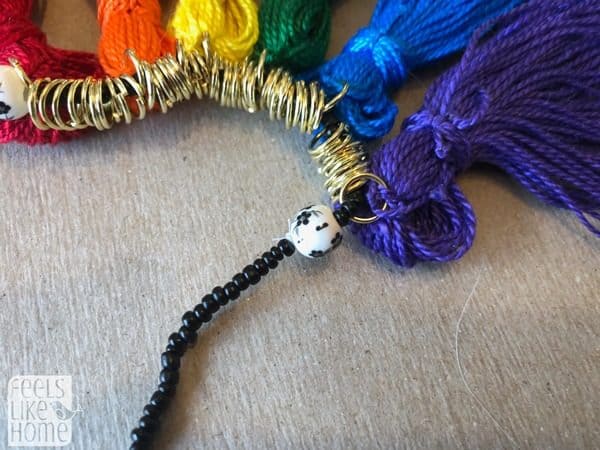 Many jump rings in between many tassels