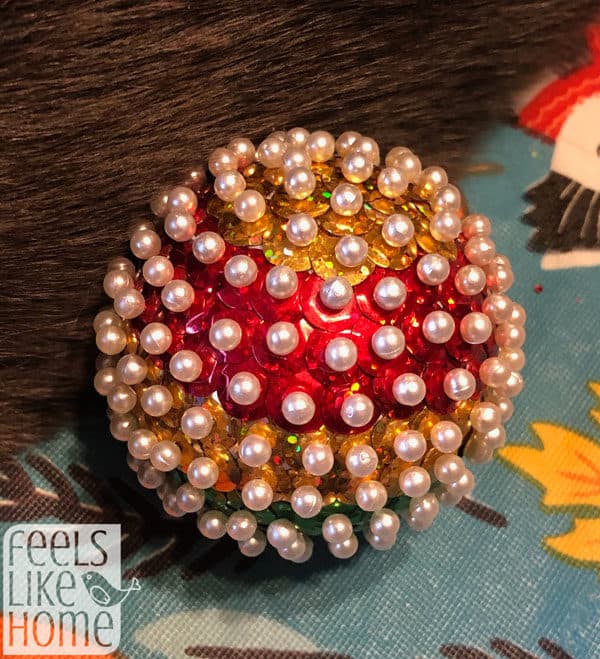 finished Christmas ornament covered with sequins and pins