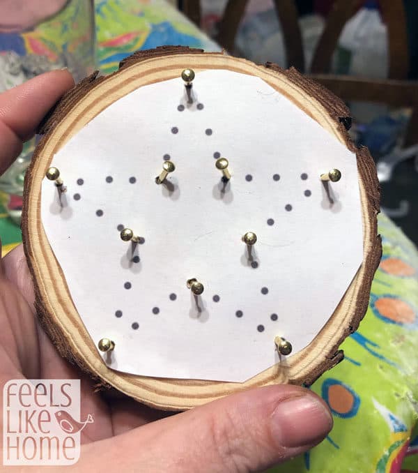 An ornament with the nails all in