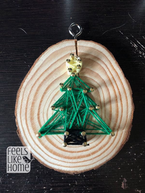 A closeup of the Christmas tree string art