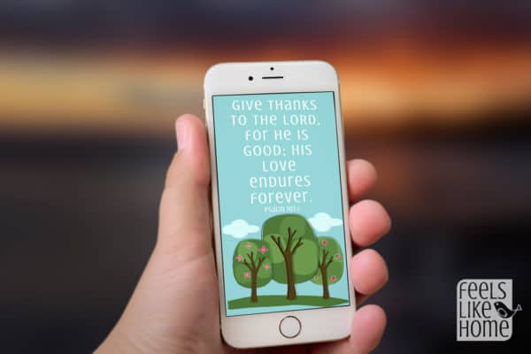 A cellphone with a Bible verse wallpaper