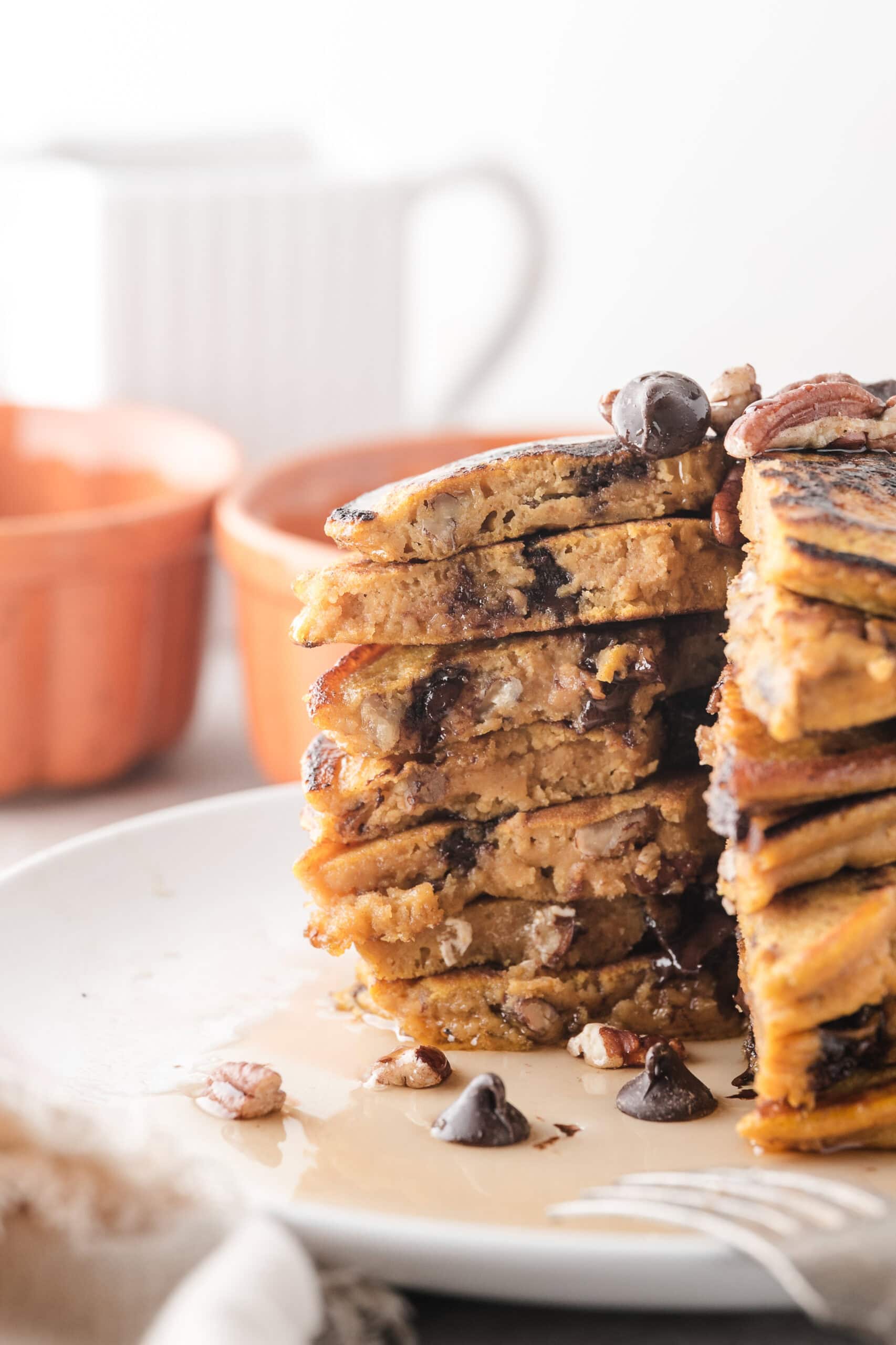 Pumpkin pancakes piled high showing the inside of the pancakes