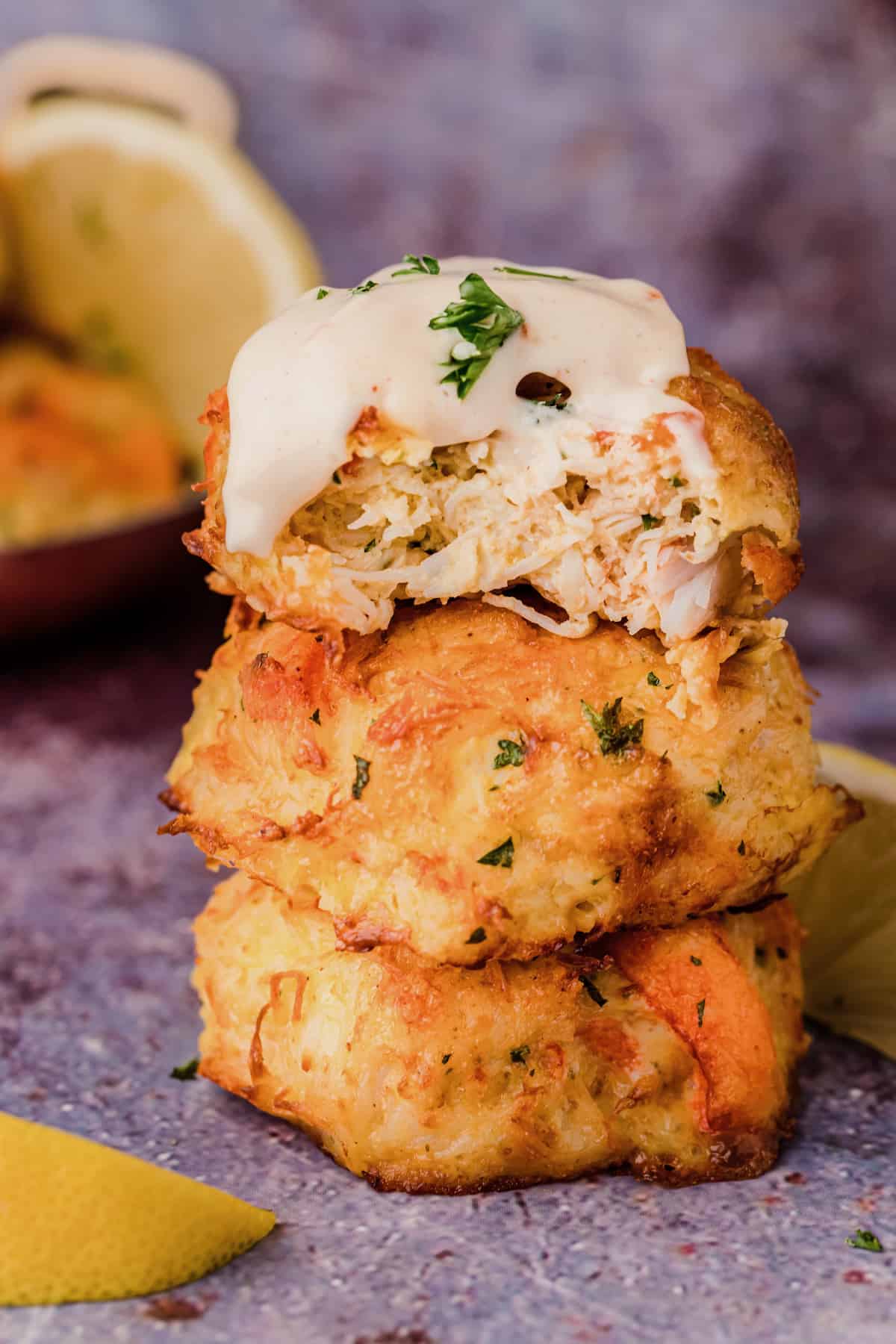 a stack of low carb crab cakes with remoulade sauce