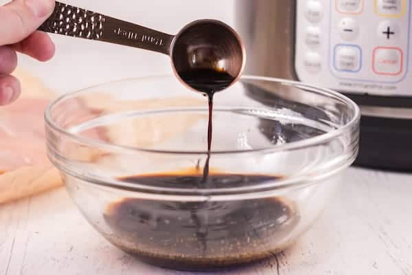 Pouring soy sauce into a bowl