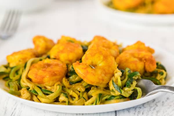 A plate of Spicy Sriracha Shrimp over zoodles