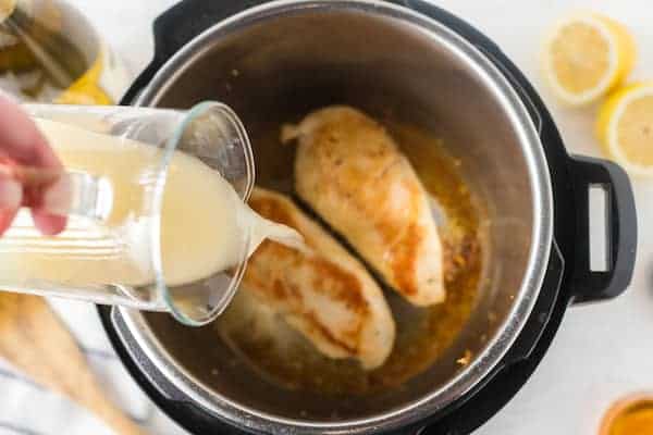 pour milk over chicken breasts