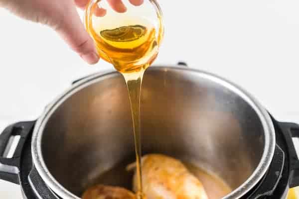 pour oil over cooked chicken breasts