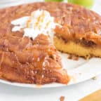 caramel apple upside down cake with whipped cream on a plate