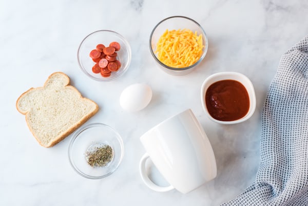 a mug and pizza ingredients