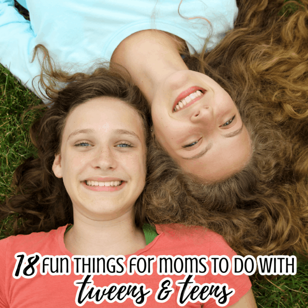 2 teen girls laying in the grass