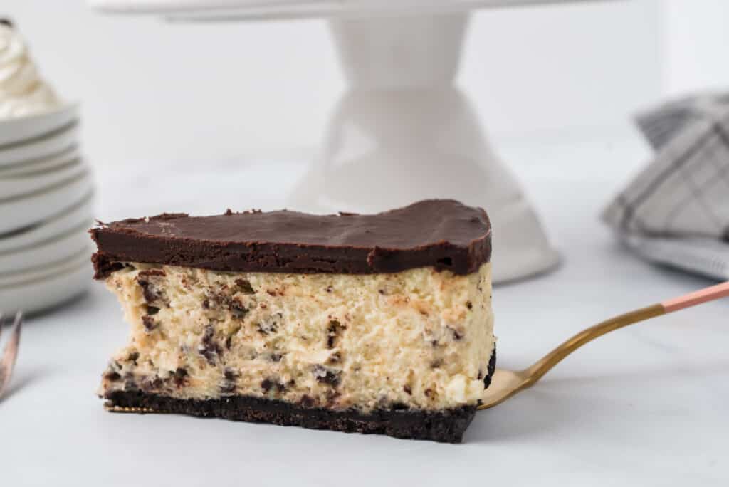 one slice of chocolate mint cheesecake on a serving spatula