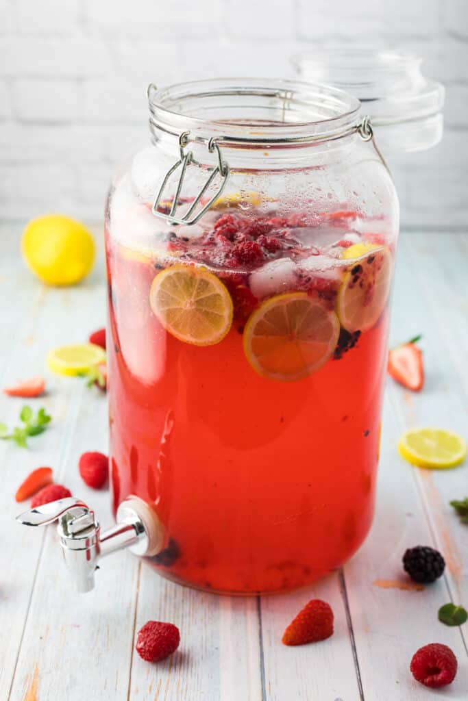 a glass jug of sparkling lemonade