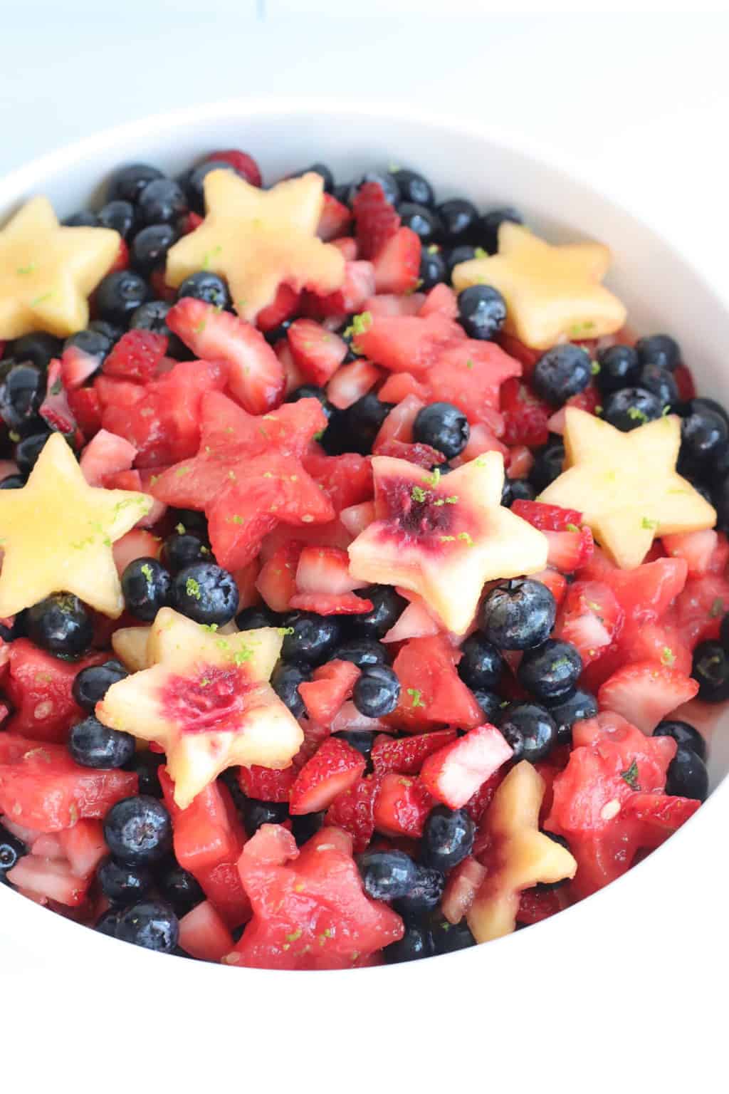 a large bowl full of fruit salad for July 4th