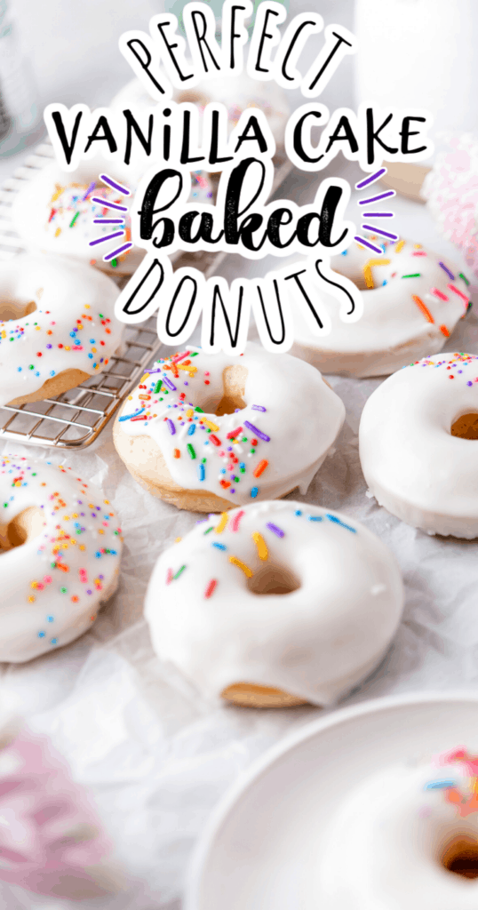 baked vanilla cake donuts with white frosting and colored sprinkles