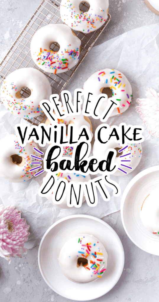 a bunch of baked vanilla cake donuts with white frosting and colored sprinkles