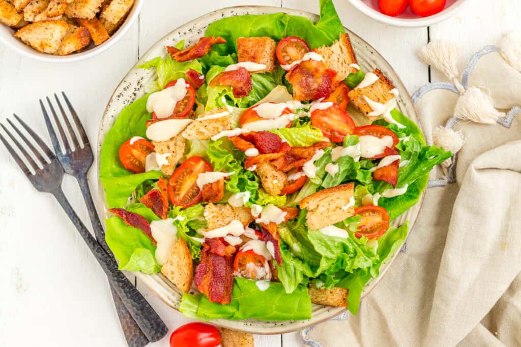 BLT salad with homemade dressing drizzled over top