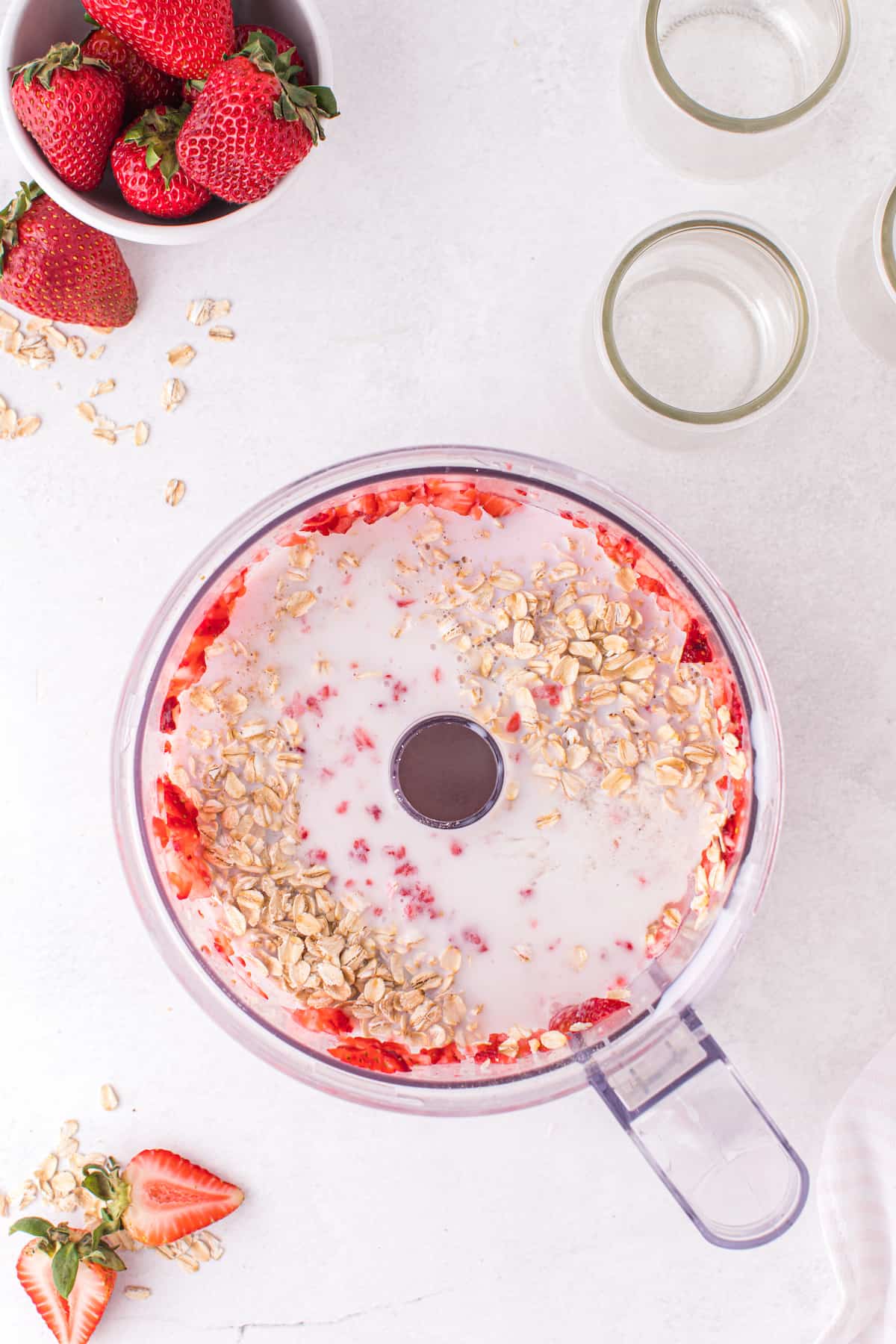 milk, oats, and pureed strawberries in a food processor