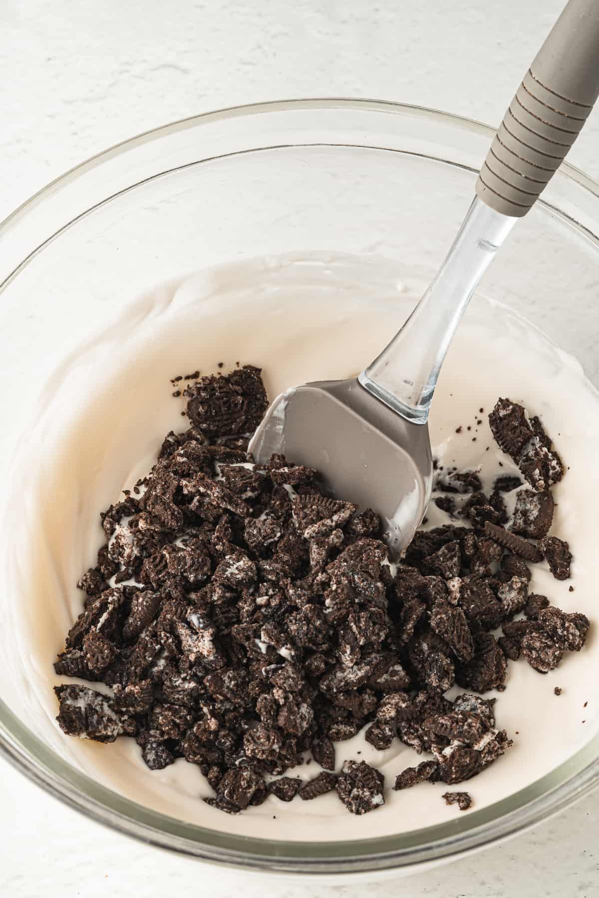 add crushed Oreo cookies to the ice cream