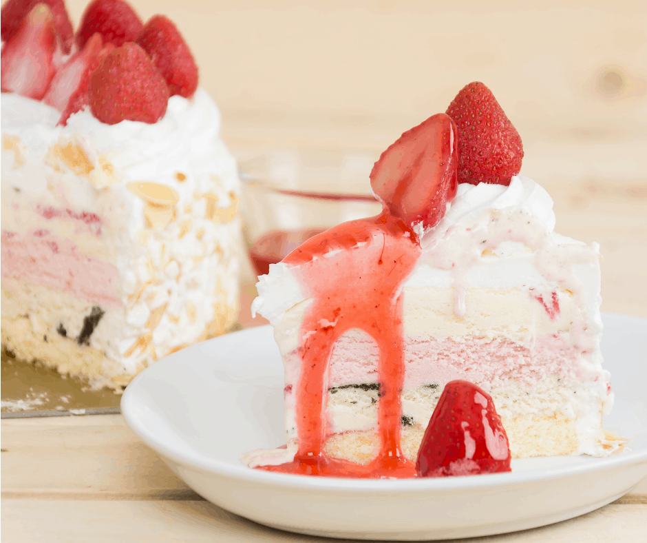 an ice cream cake topped with strawberries