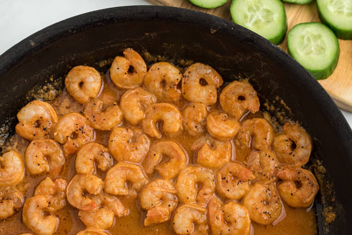 shrimp cooking in a cast iron skillet