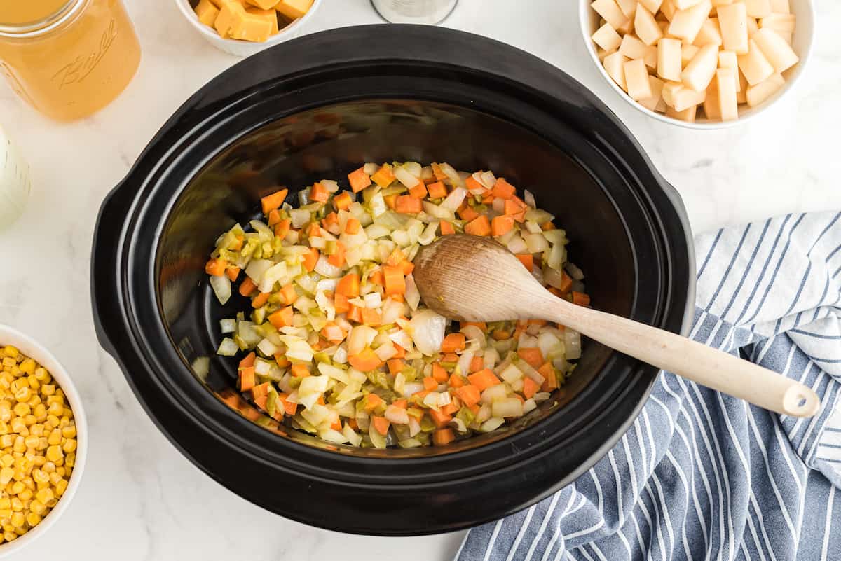 add cooked veggies to the slow cooker