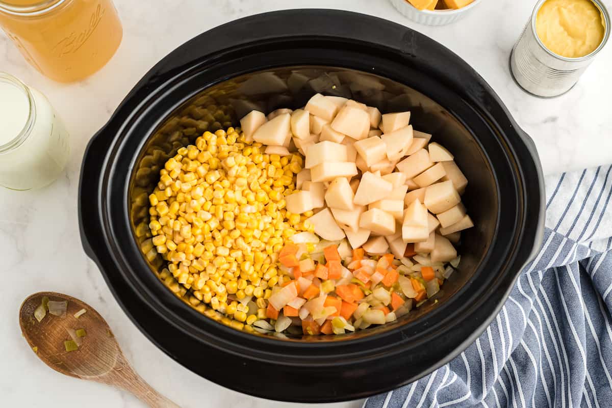 add potatoes and corn to the crockpot