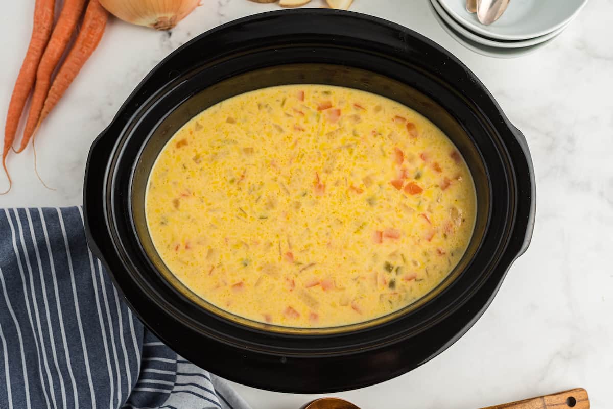 add milk and Velveeta to the crockpot