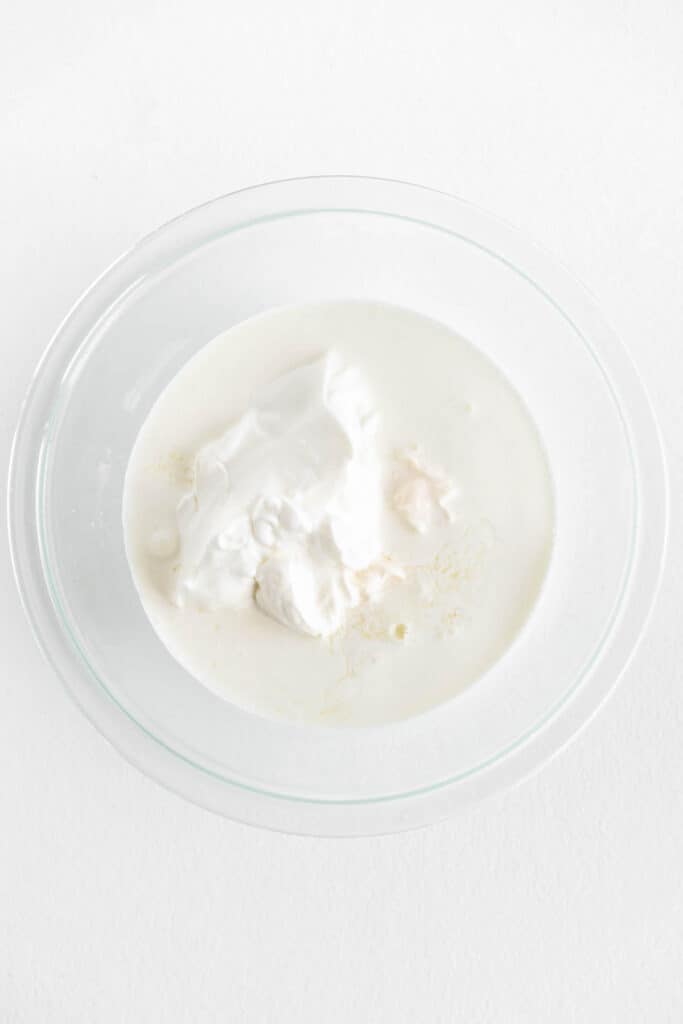 mayo, Greek yogurt, and heavy cream in a bowl