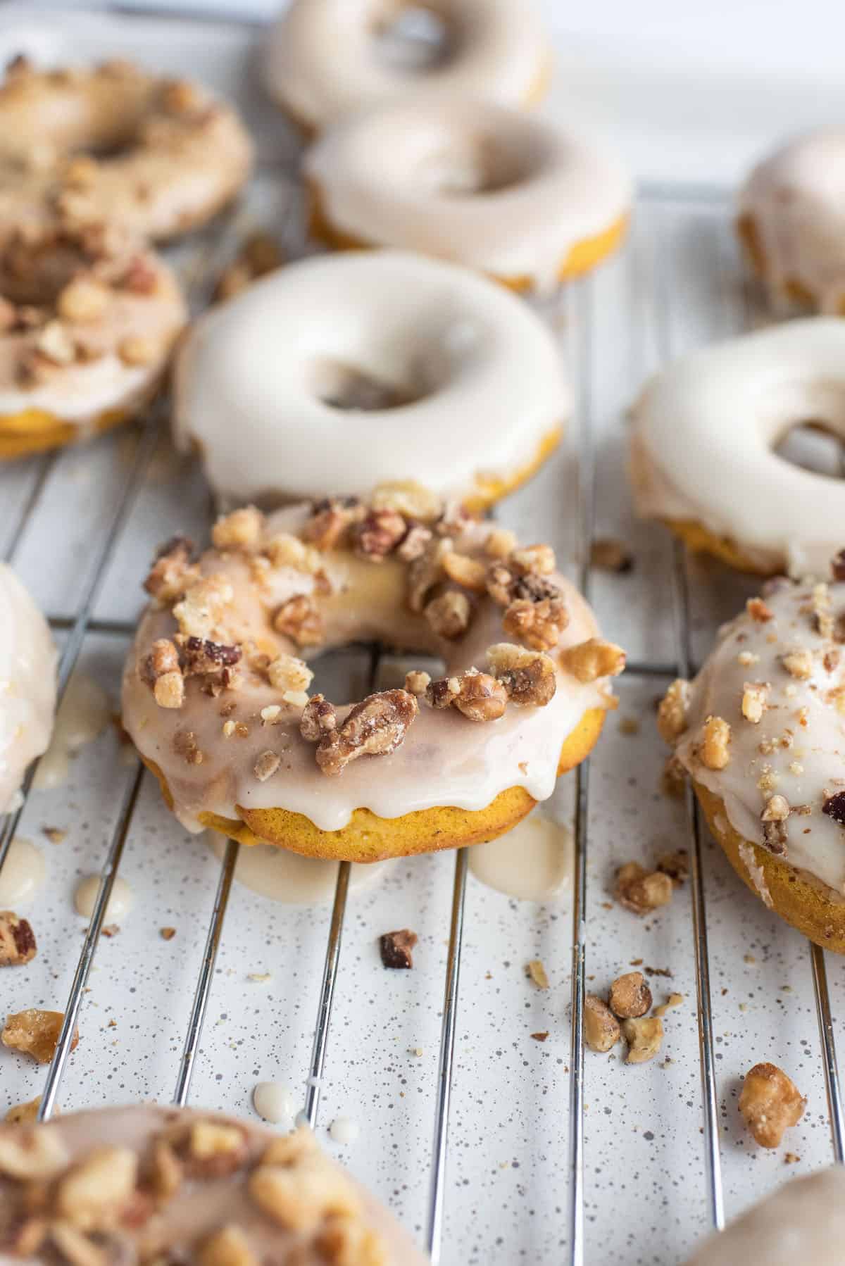 sprinkle glazed donuts with walnuts