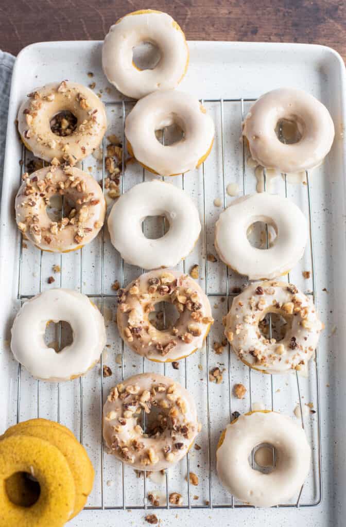 pumpkin spice donuts, some glazed and some with walnuts