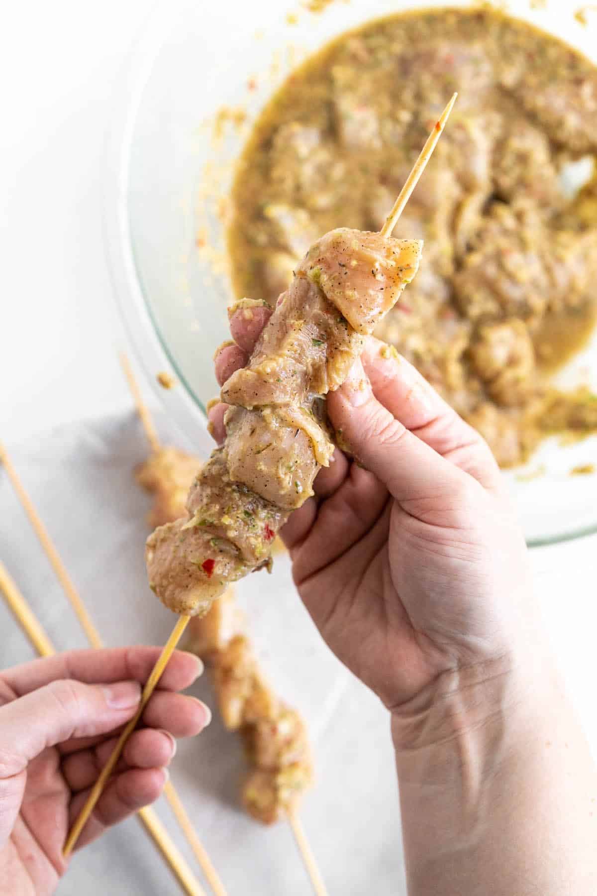 thread the chicken onto the skewers