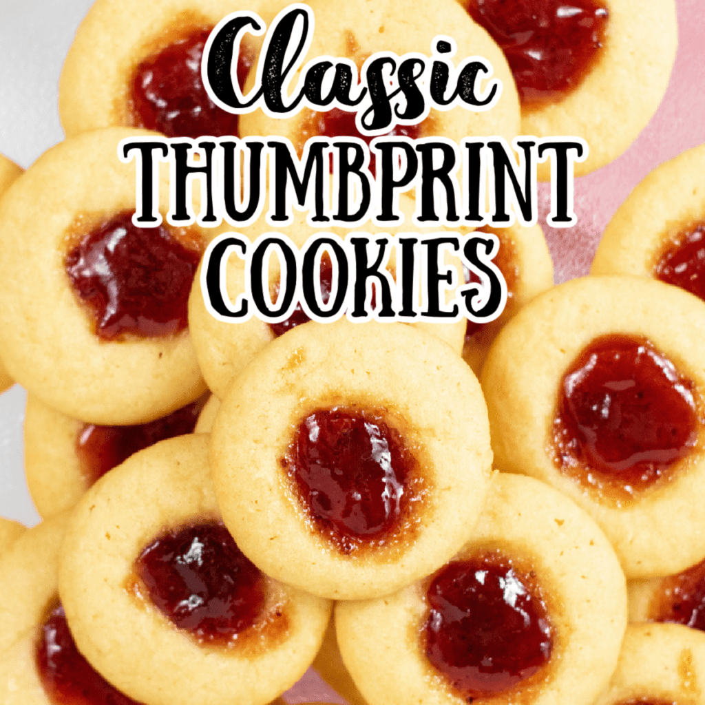 a closeup of thumbprint sugar cookies with jam centers