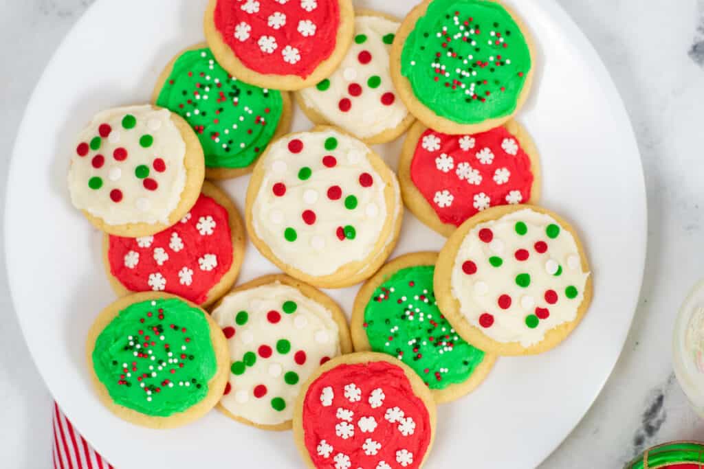 a large platter full of frosted sugar cookies