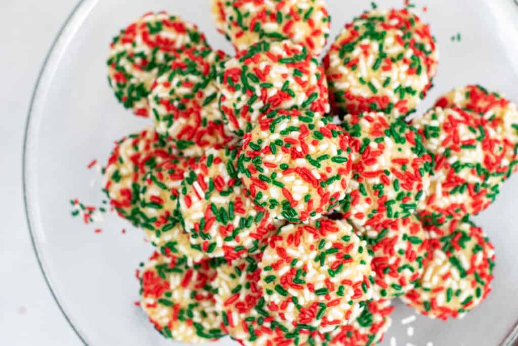 a platter full of cookies with sprinkles