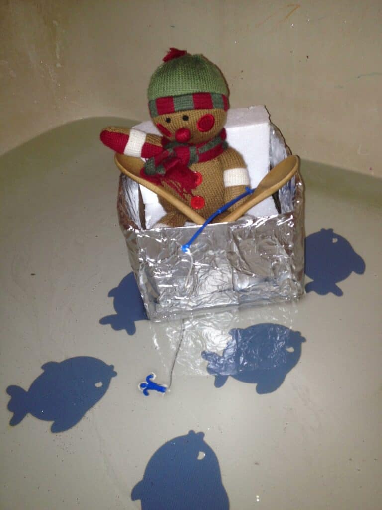 Elf on the Shelf fishing in the bathtub