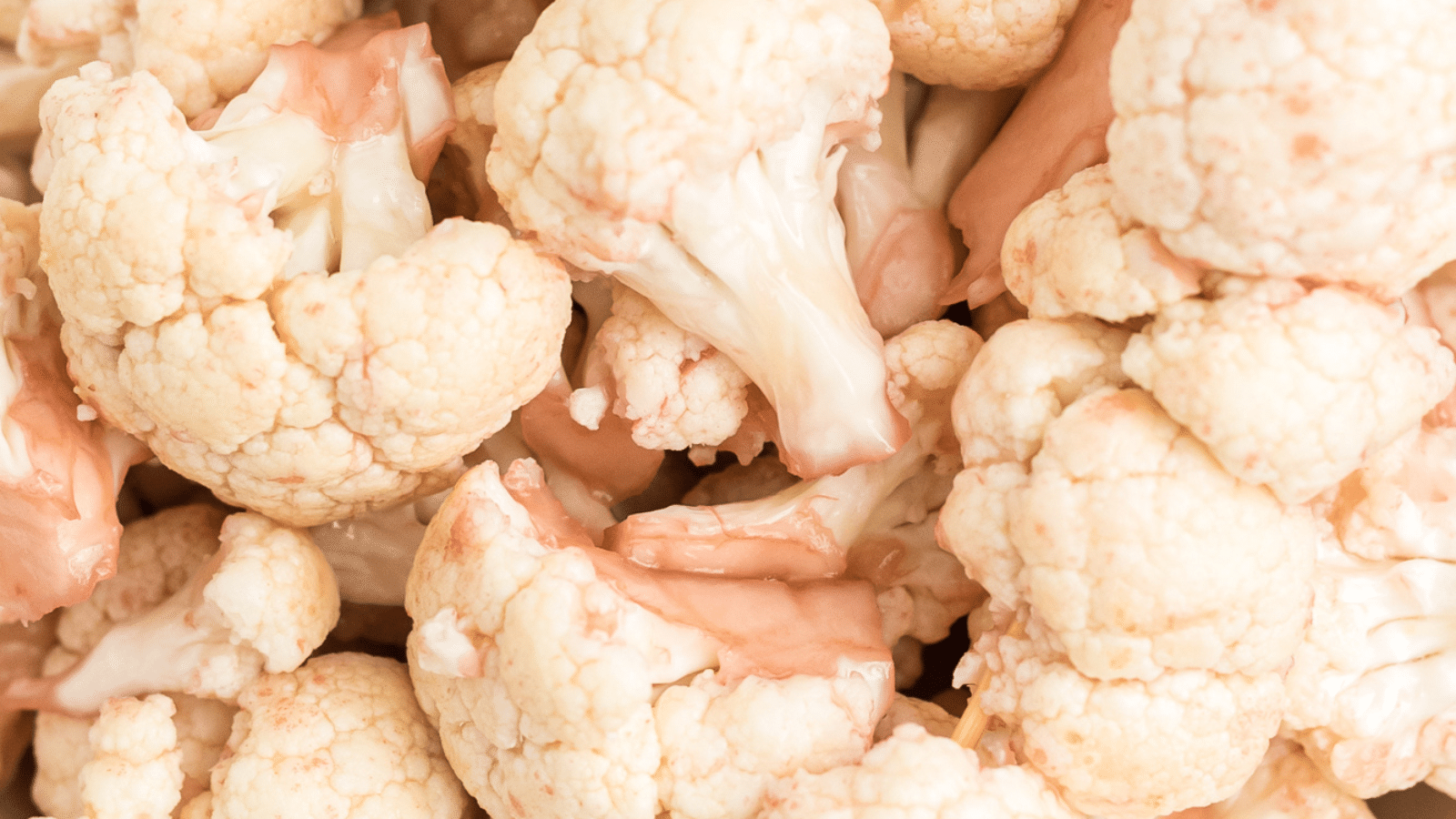 a close up of cauliflower marinated in red wine vinaigrette