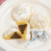 secret kiss cookies with one cut in half and 2 hershey's kisses