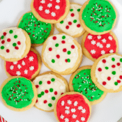 a close up of a large platter full of frosted sugar cookies