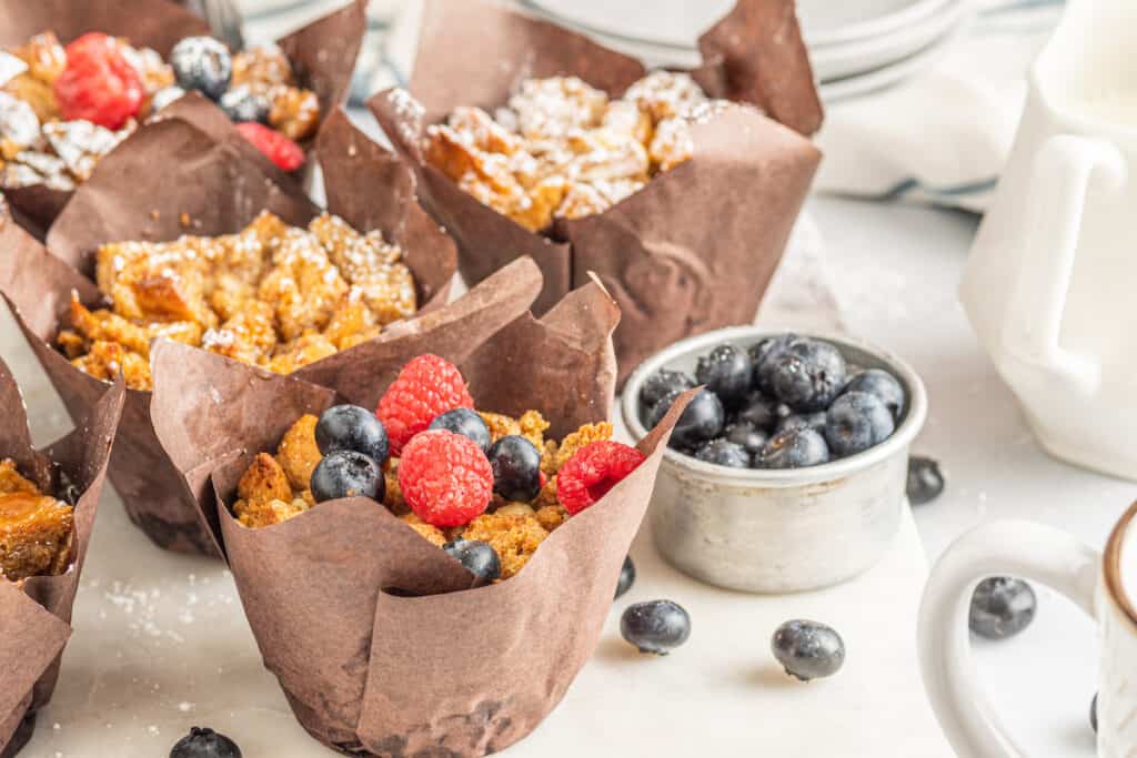 French toast muffins with berries and powdered sugar