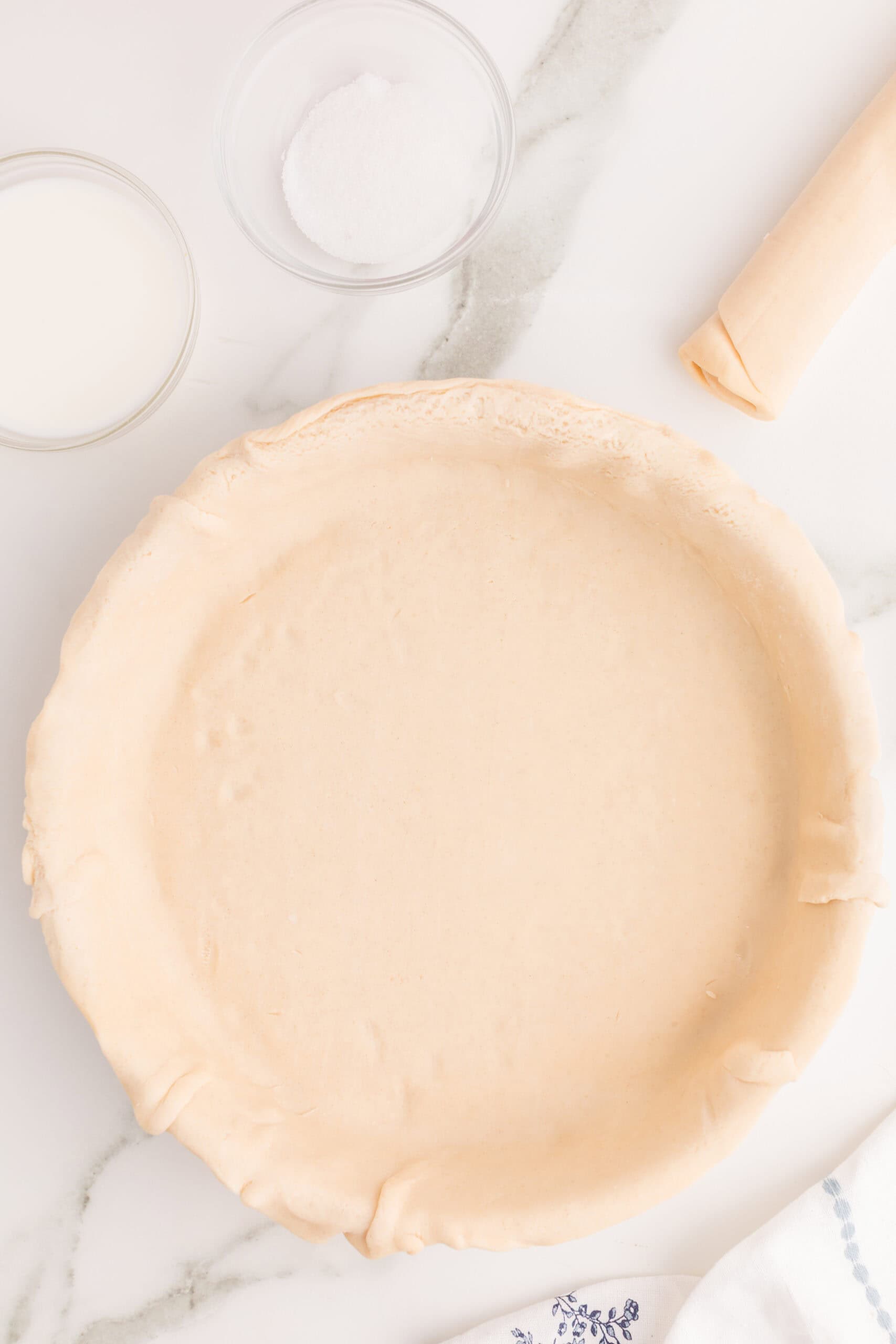 Preparing refrigerated pie crust for easy cherry pie