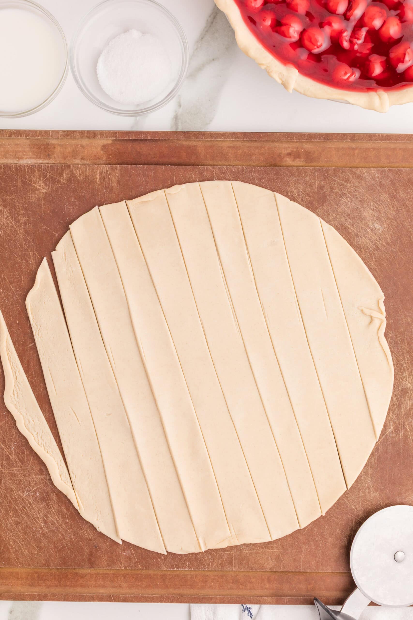 Cutting pastry strips for cherry pie lattice crust