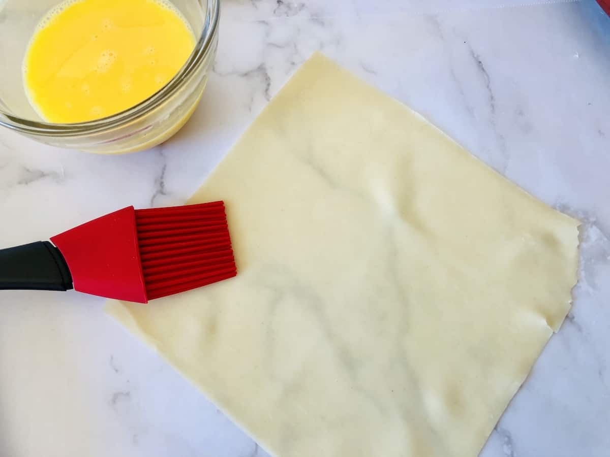 brush the egg roll wrappers with egg wash