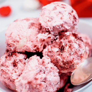a close up of no churn red velvet ice cream with a spoon